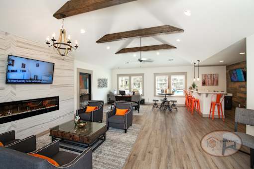 The clubhouse lounge, complete with coffee bar, fireplace, flat screen TV, and lounge area.