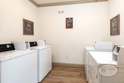 A community laundry room with washers and dryers.