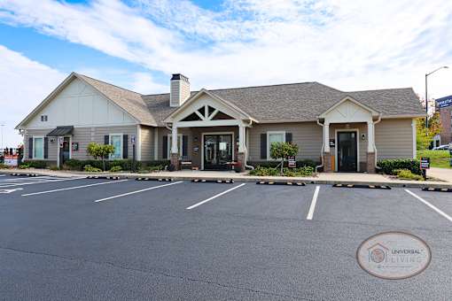 A building with a parking lot in front of it.