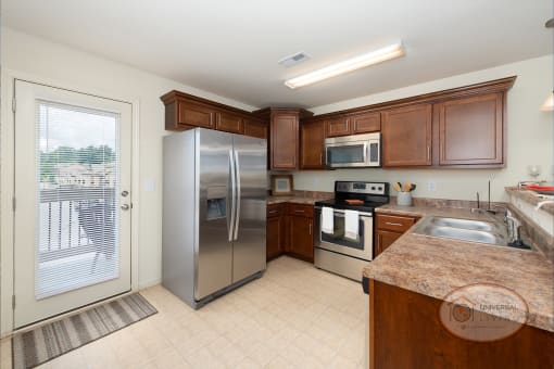 a kitchen with stainless steel appliances and wooden cabinets
