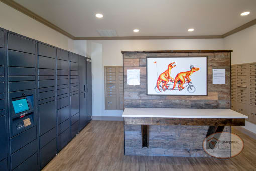 The mail center and Amazon hub with lockers and a picture of dinosaurs above a table.