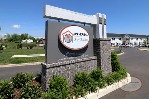 The property entrance sign that reads "Universal at Gray Station."