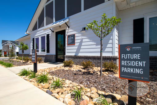 The clubhouse entrance with a sign in front of it that says "Future Resident Parking."