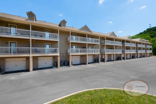an image of an empty parking lot in front of an apartment building