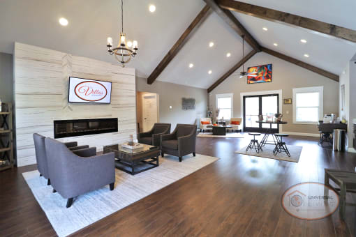 a living room with couches and chairs and a fireplace