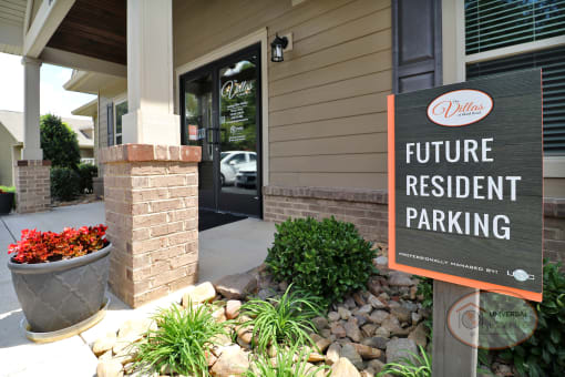 a sign in front of a building that reads future resident parking