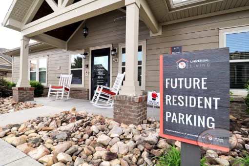A sign in front of the clubhouse that reads "Future Resident Parking."