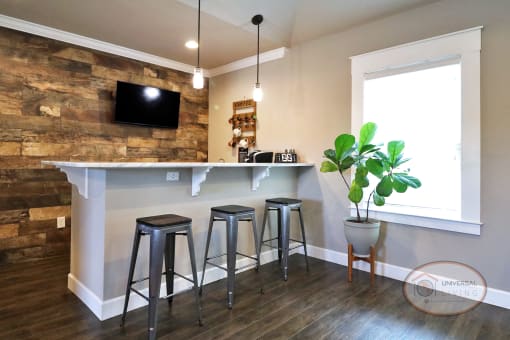 A coffee bar and lounge complete with flat screen TV, free coffee, dog treats and more.