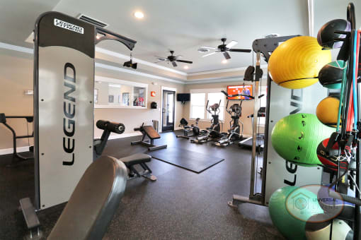 A fitness center with weight training and cardio equipment .
