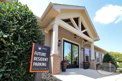 A future resident parking sign in front of the clubhouse.