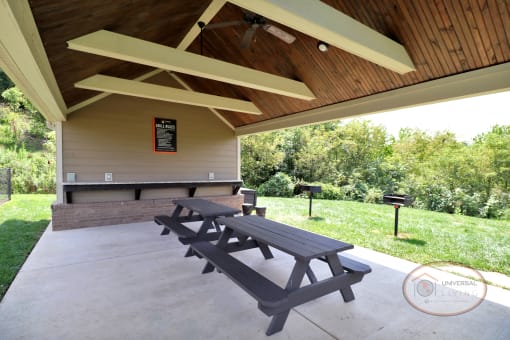 A covered pavilion with picnic tables.