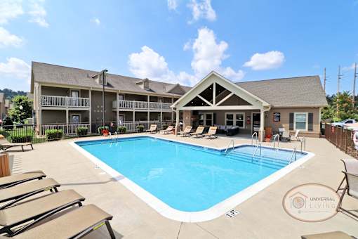 our resort style swimming pool is next to our building with lounge chairs