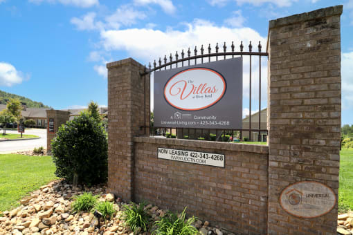 The property sign reads "The Villas at River Bend."