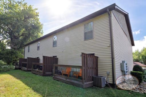 The rear of an apartment home with patios.