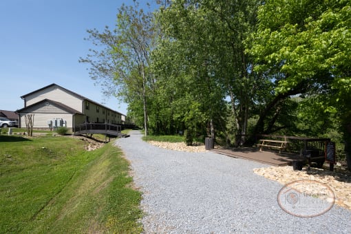A gravel walking path that goes through the community along the river.