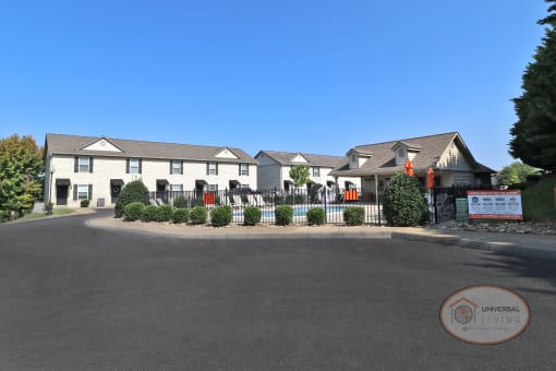 a view of the front of the inn on the lake building from the road