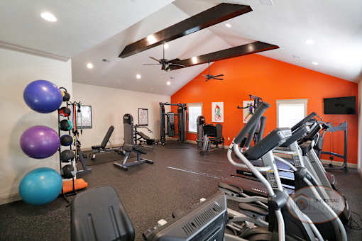 gym with exercise equipment at the district at highland village apartments