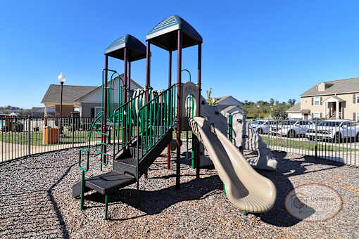 a playground with a slide in a park