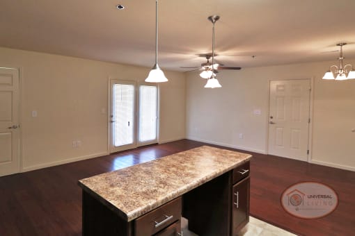 An empty living room with a patio door visible.