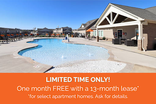 A pool area with a sign offering a free month with a 13-month lease for select apartment homes.
