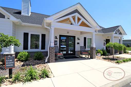 A close up of the front of the white and gray clubhouse.