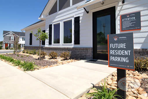 A sign in front of the clubhouse that says "Future Resident Parking."