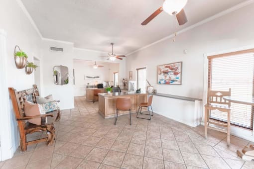 Open concept living space with wood ceiling fans at Cantera Apartments, Texas
