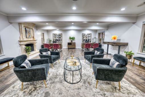 Community clubhouse with modern seating and fireplace at Le Montreaux Apartments, Austin, TX 78759
