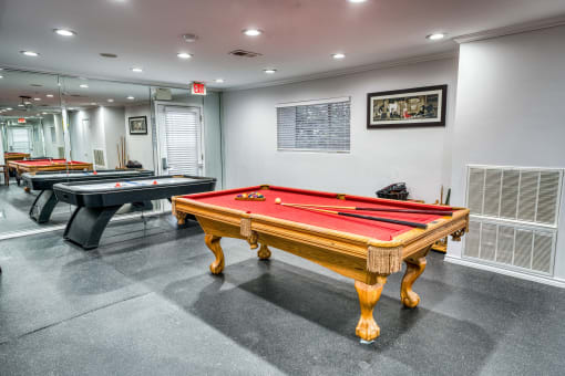 Billiards room with red felt pool table at Le Montreaux Apartments, Austin
