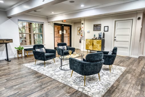Lobby seating area with velvet chairs and gold accents at Le Montreaux Apartments, Austin, TX 78759