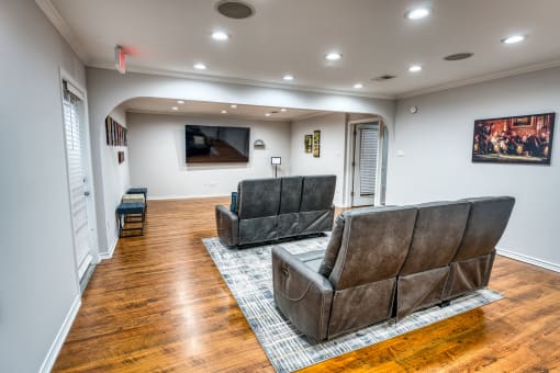 Basement recreation room with leather recliners at Le Montreaux Apartments, Texas, 78759