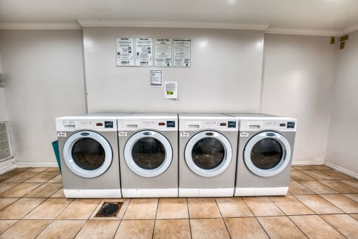 Laundry facility with front loading washers at Le Montreaux Apartments, Austin, TX 78759