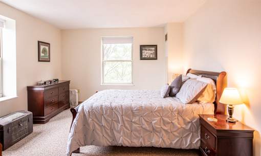 large bedroom with huge windows
