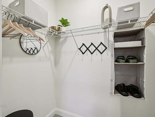 White closet with shoe rack and chair at Ardmore Meadows, North Carolina