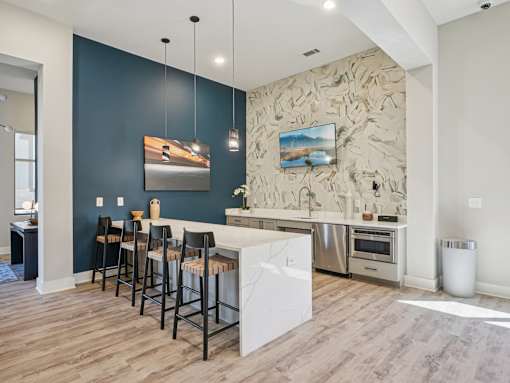 Kitchen with white island and bar stools at Ardmore Meadows, Whitsett, NC