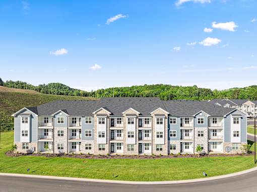 Modern apartment community exterior with landscaping at Ardmore at Prosperity Apartments, Knoxville, Tennessee