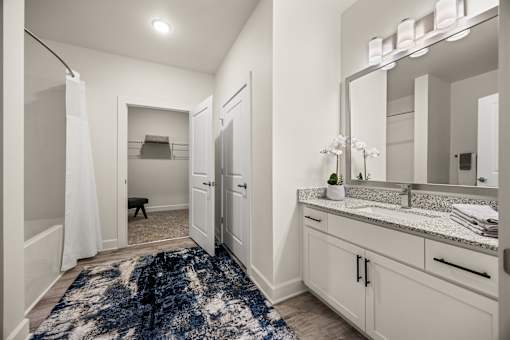 Bathroom with granite countertop and white vanity at Ardmore at Prosperity Apartments, Knoxville, TN 37932