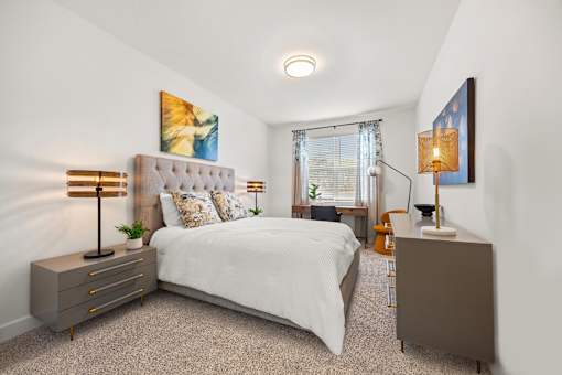 Cozy bedroom with tufted headboard and modern furnishings at Ardmore at Prosperity Apartments, Knoxville, 37932