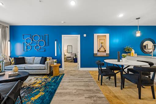Open concept living and dining area with blue wall at Ardmore at Prosperity Apartments, Knoxville