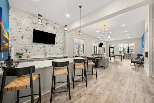 Clubhouse bar area with seating and modern finishes at Ardmore at Prosperity Apartments, Knoxville, TN