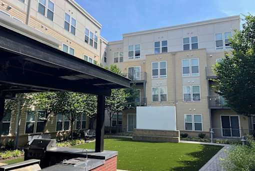 A building with a white board in front of it.