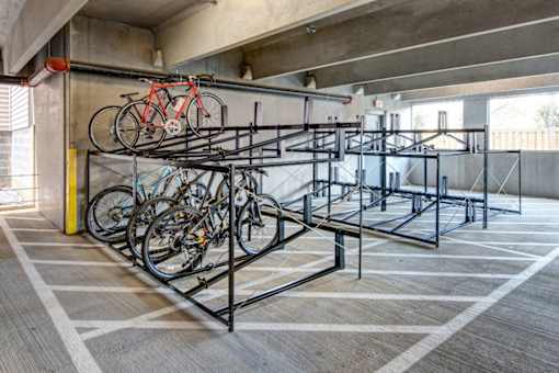 A bike rack with many bikes on it.