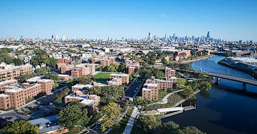an aerial view of the city and the river