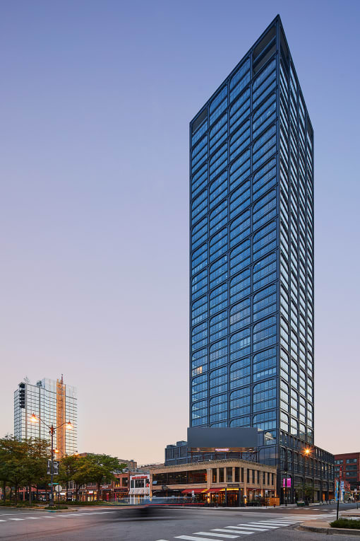 a tall skyscraper at dusk