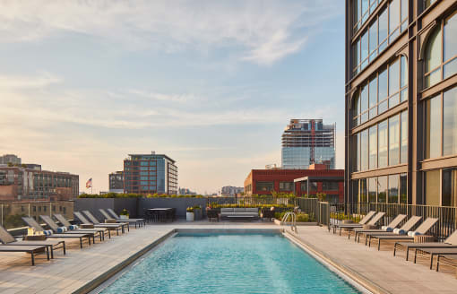 this is a photo of a swimming pool on the roof of a building in the city