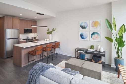 a living area with a kitchen and dining area