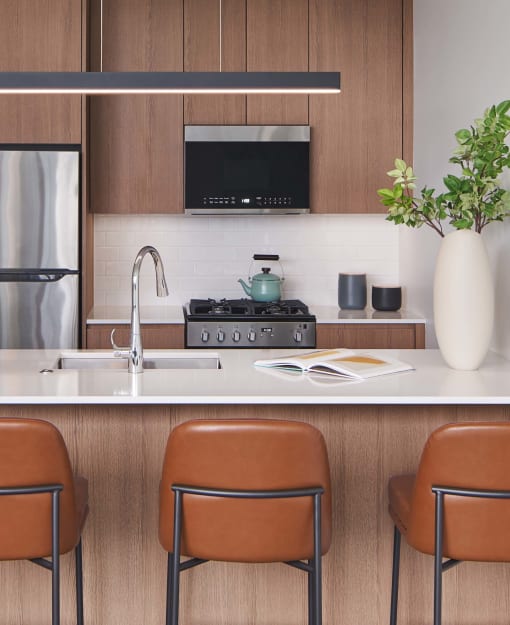 a kitchen with a sink and a stove