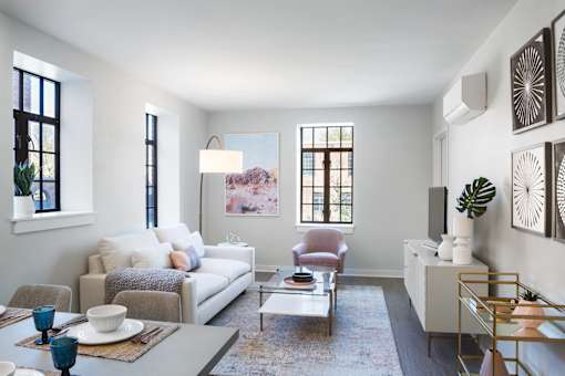 a living room with a white couch and a table