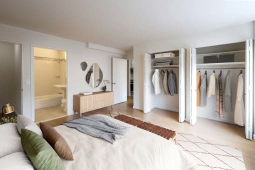 a bedroom with a bed and a closet