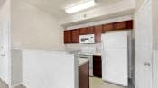 a kitchen with a refrigerator and a sink